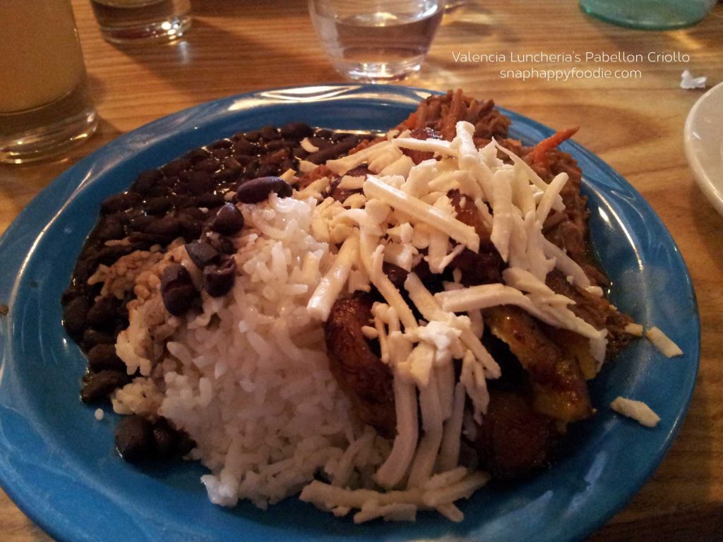 Carne mechada, rice, beans, queso blanco and plantains. 